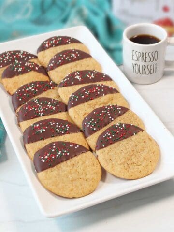 Coffee cookies on platter with cup of espresso.