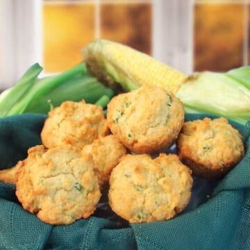 Closeup of cornbread muffins in basket.