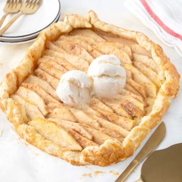 Apple Puff Pastry Galette with scoops of ice cream on top.