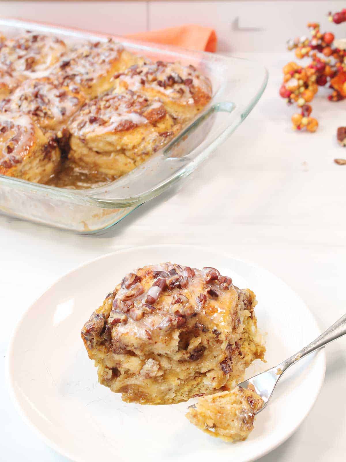 Serving of casserole on plate with bite on fork.