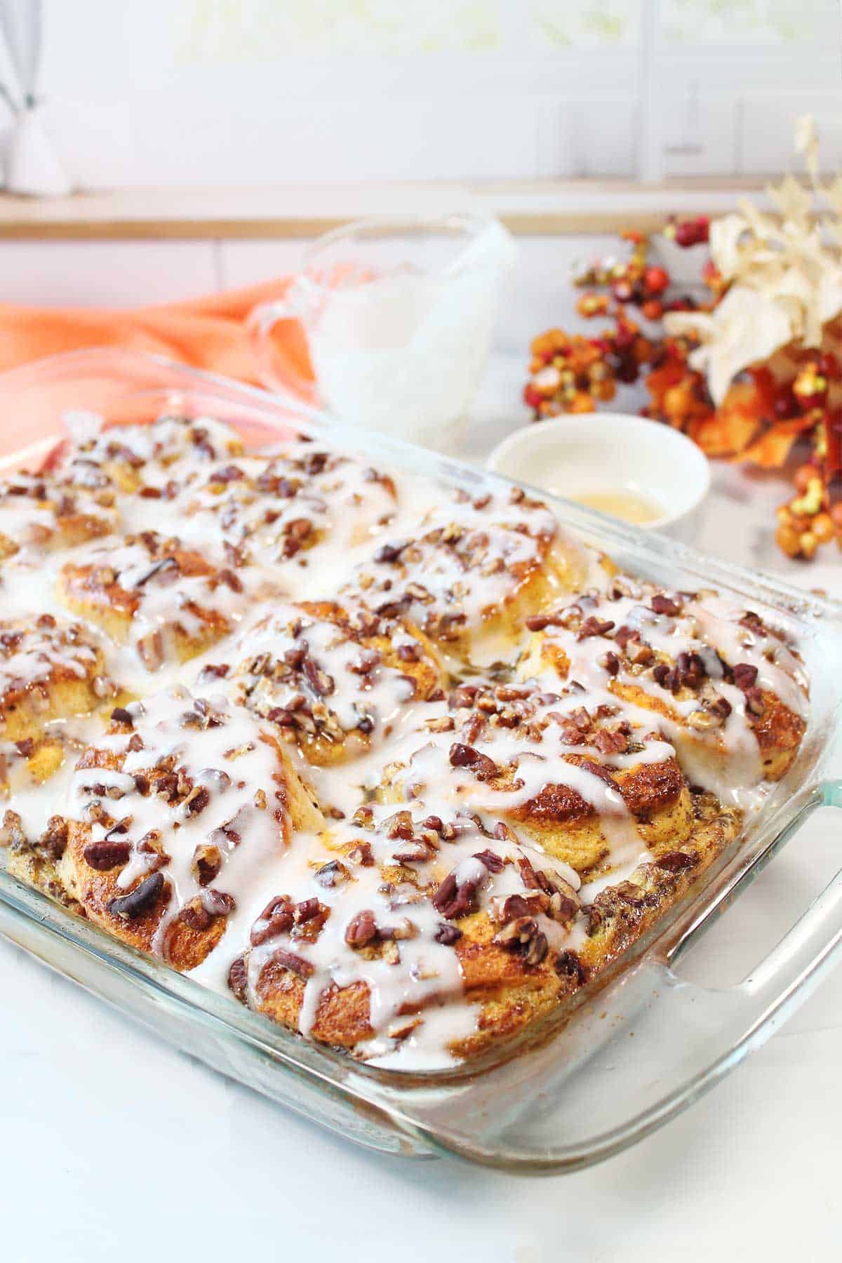 Cinnamon Roll French Toast with icing on kitchen table.