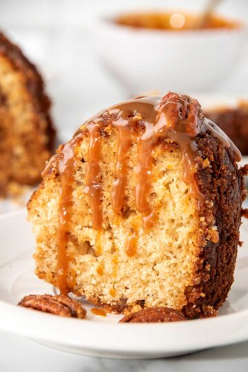 Slice of pound cake drizzled with caramel syrup.