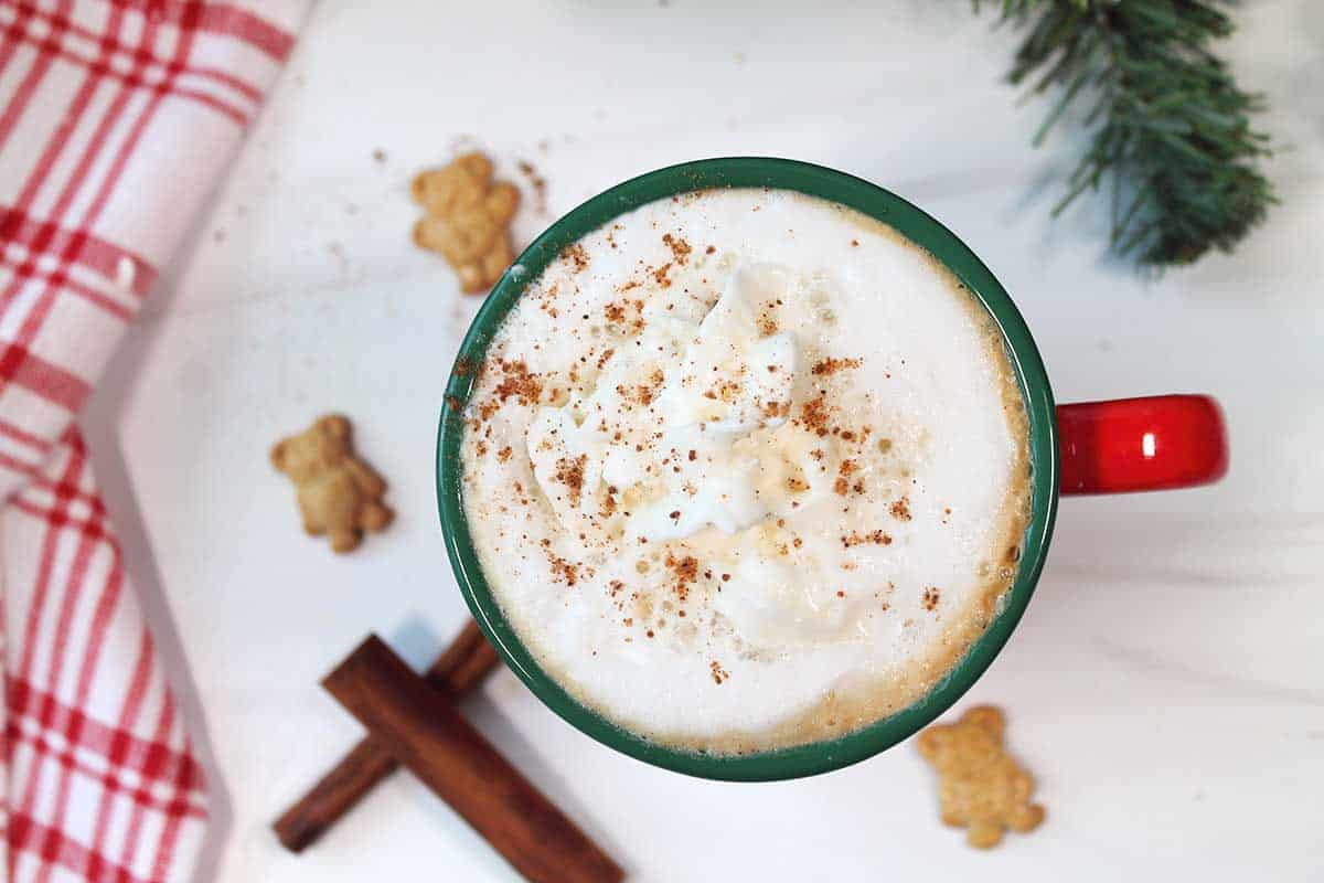 Overhead of latte with whipped cream and nutmeg.