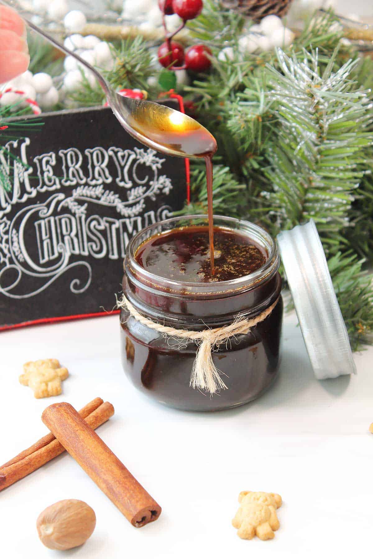 Gingerbread Syrup in glass jar with spoonful.