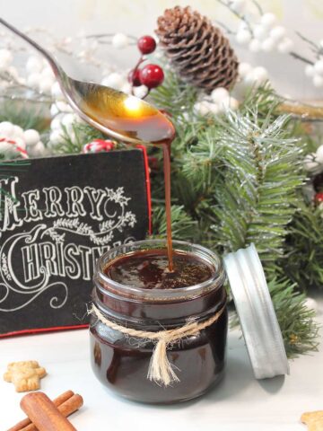 Gingerbread syrup in jar by Christmas garland.