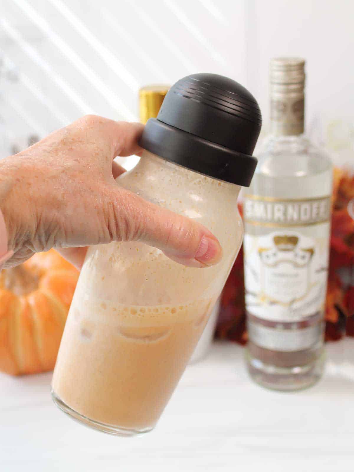 Shaking pumpkin rumchata martini to mix.