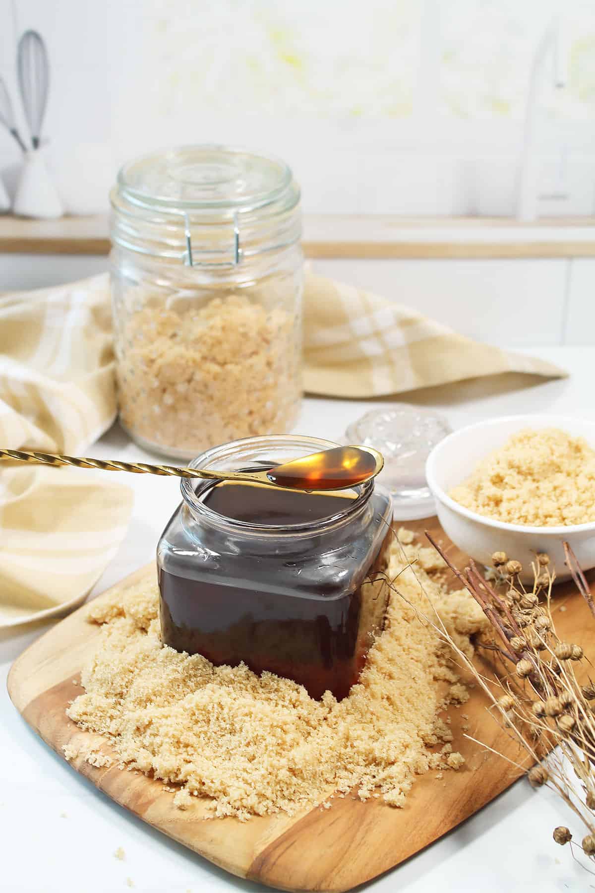 Spoon resting on jar of simple syrup.