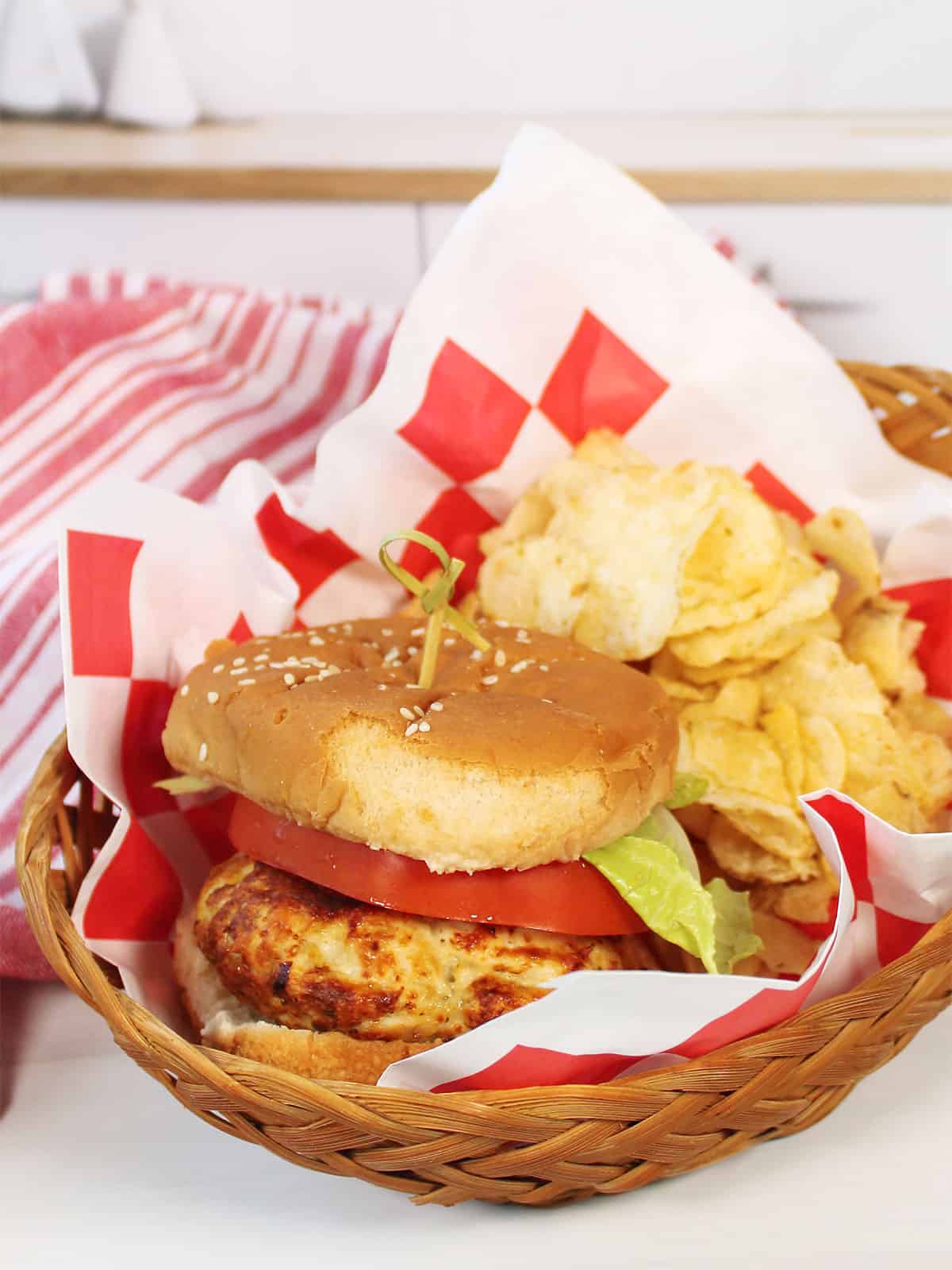Chicken Burger in basket with chips.