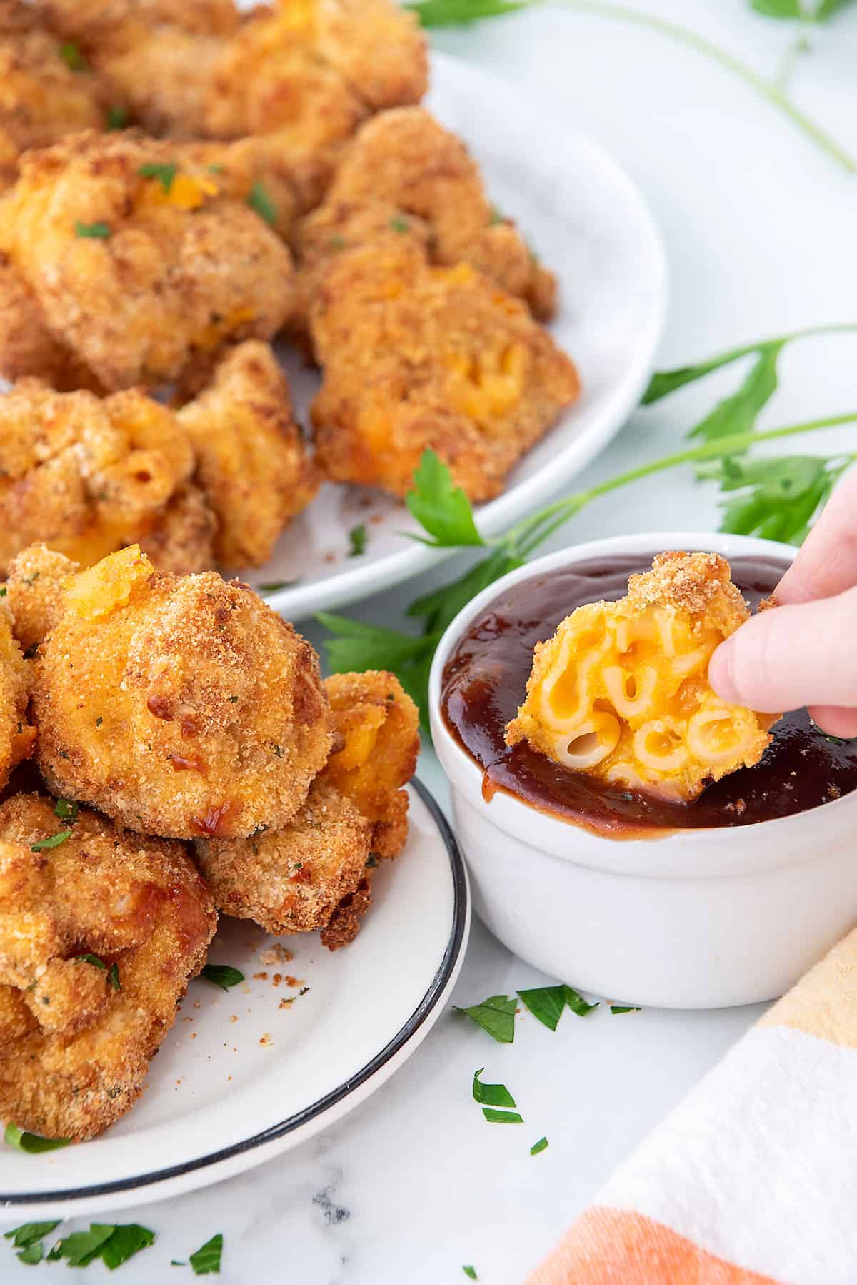 Dipping bites into dipping sauce.