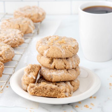 Plated coffee cake cookies with cup of coffee.
