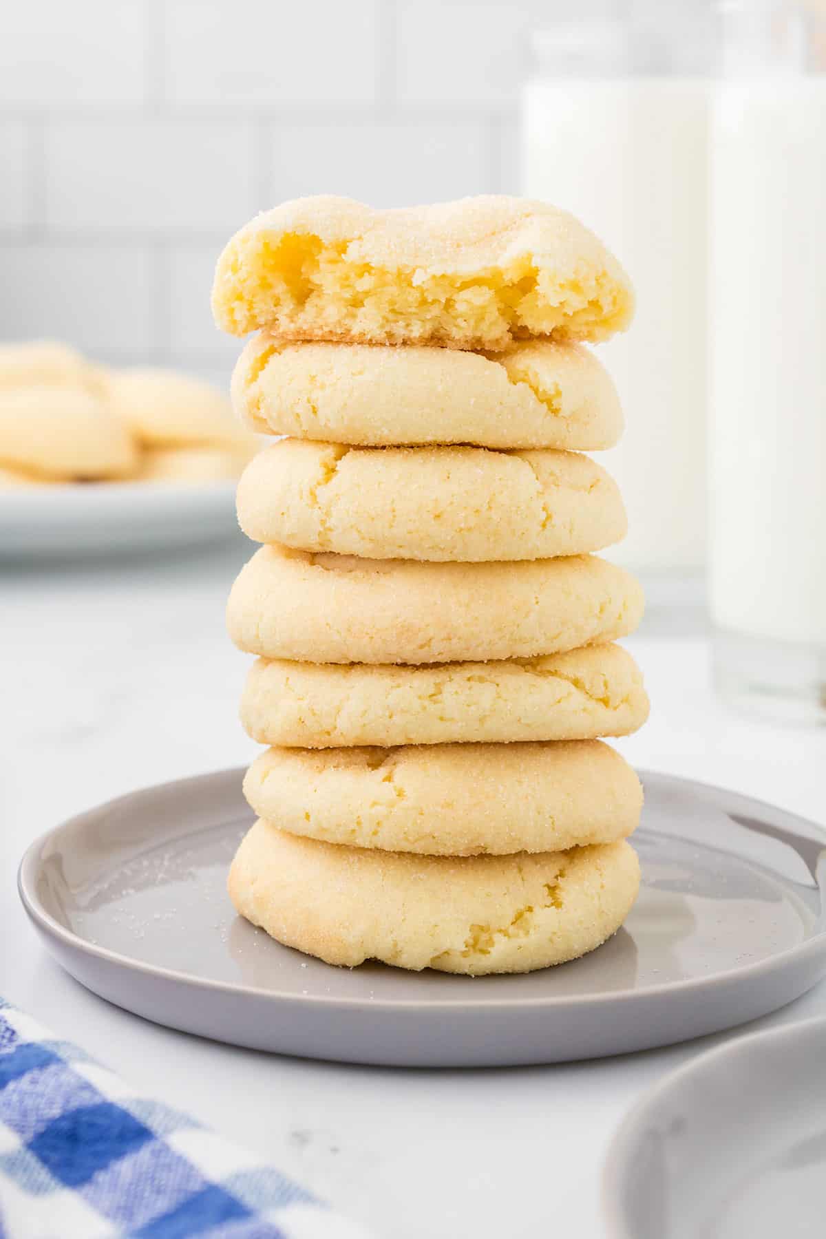 White Cake Mix Cookies stacked with bite out of top one.