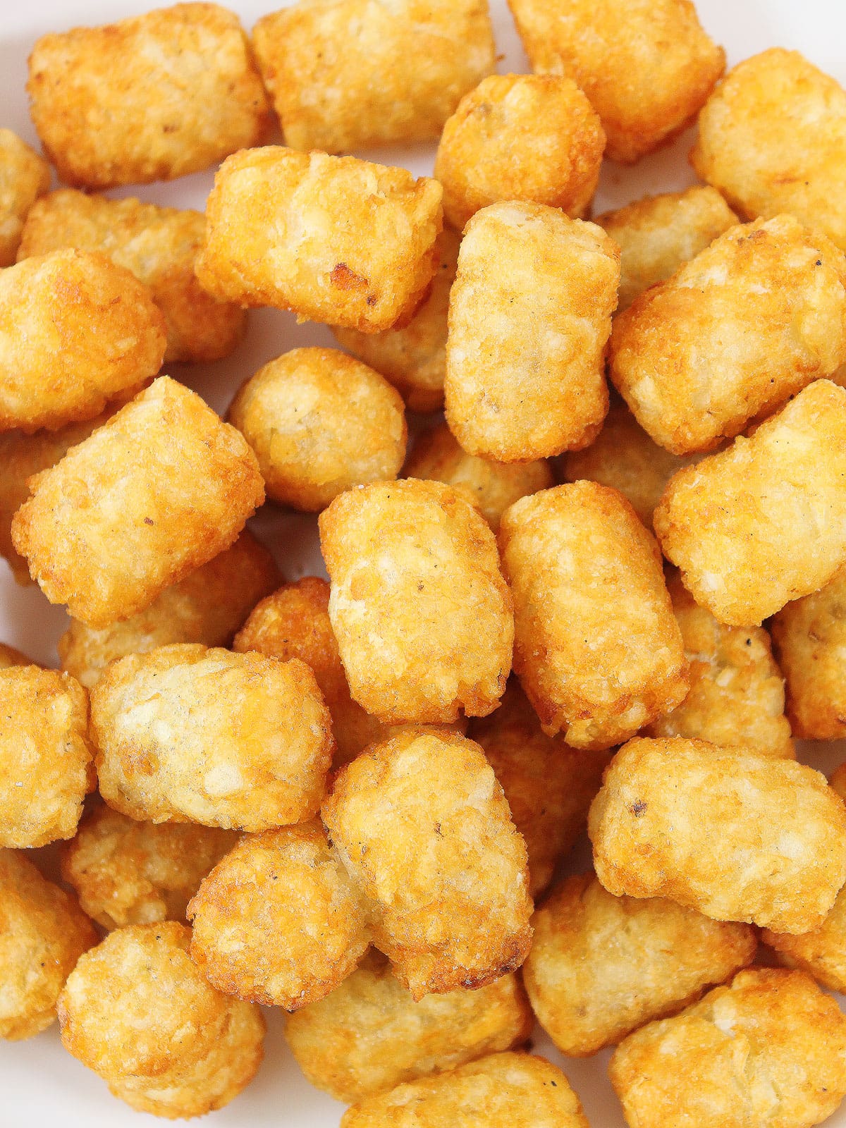Closeup of extra crispy tater tots.