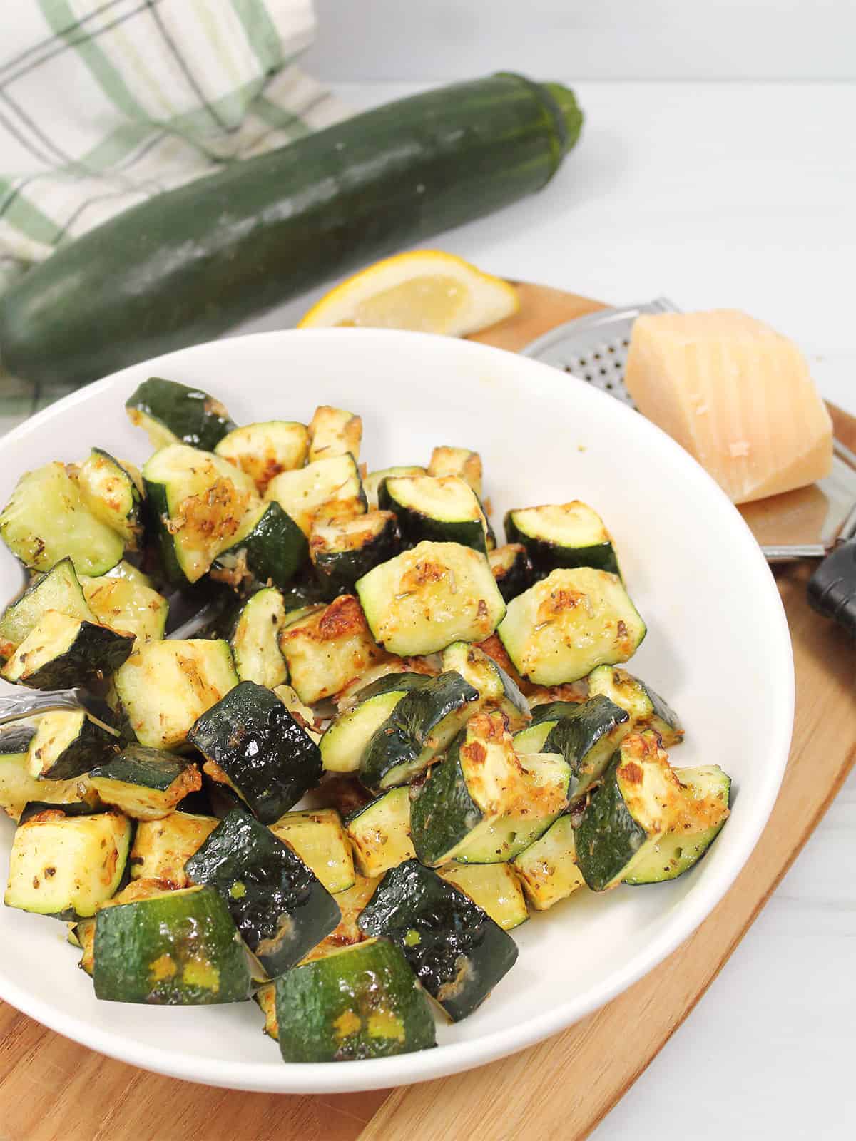 Air Fryer Zucchini with parmesan cheese in serving bowl.