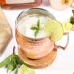 Kentucky Mule on coaster with lime slice garnish.
