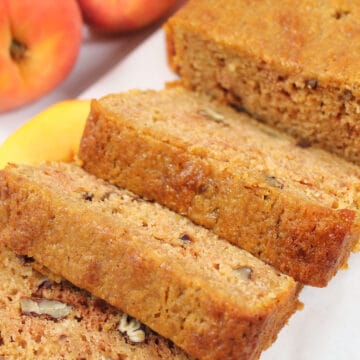 Closeup of sliced peach quick bread.