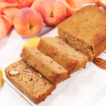 Peach Bread sliced on cutting board.