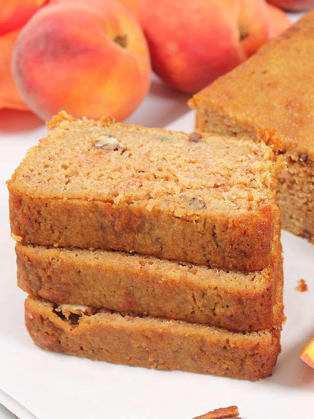 Stacked slices of peach bread.