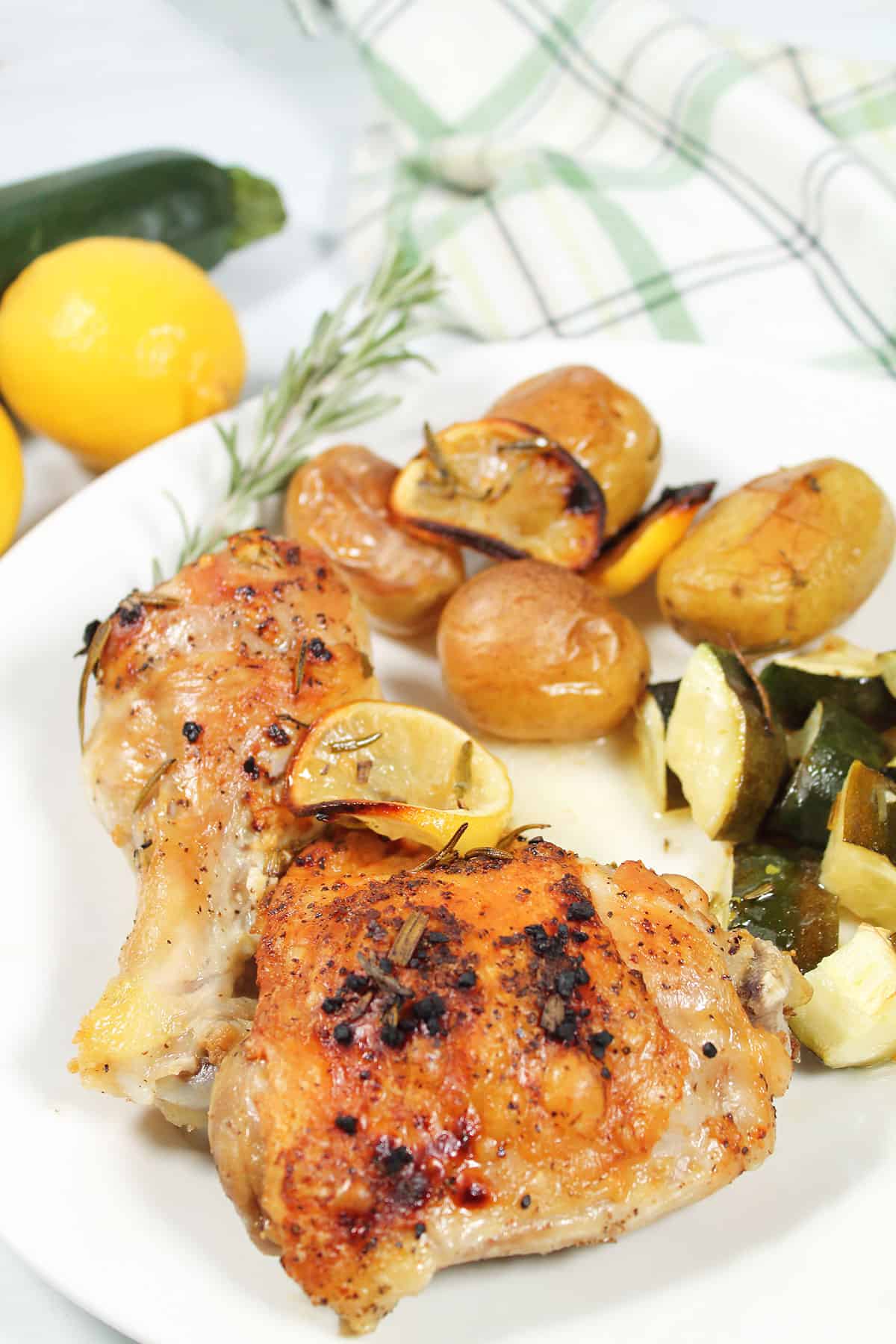 Plated Sheet Pan Lemon Rosemary Chicken dinner.