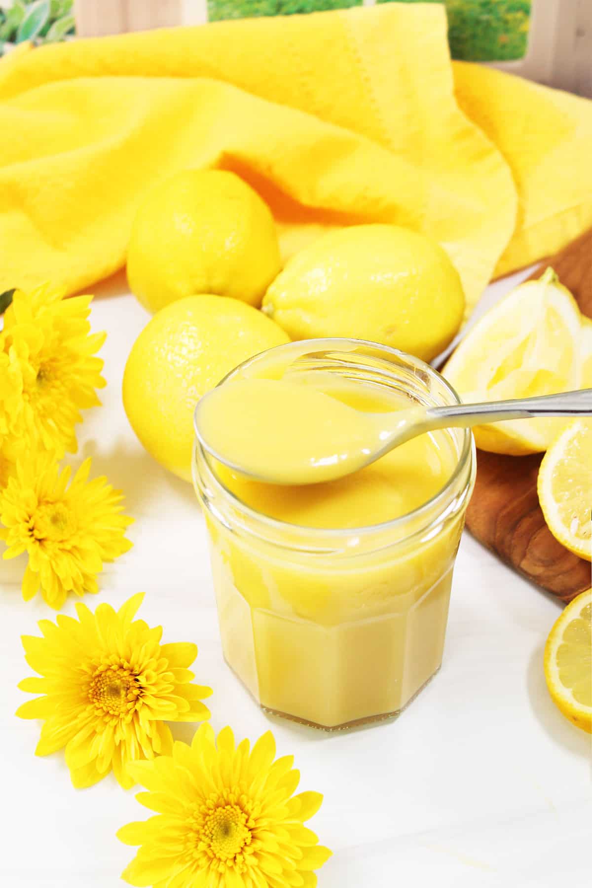 Easy homemade lemon curd with spoonful on top.