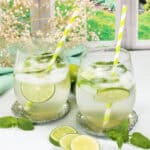 Two Hugo Spritz drinks with mint and lime.