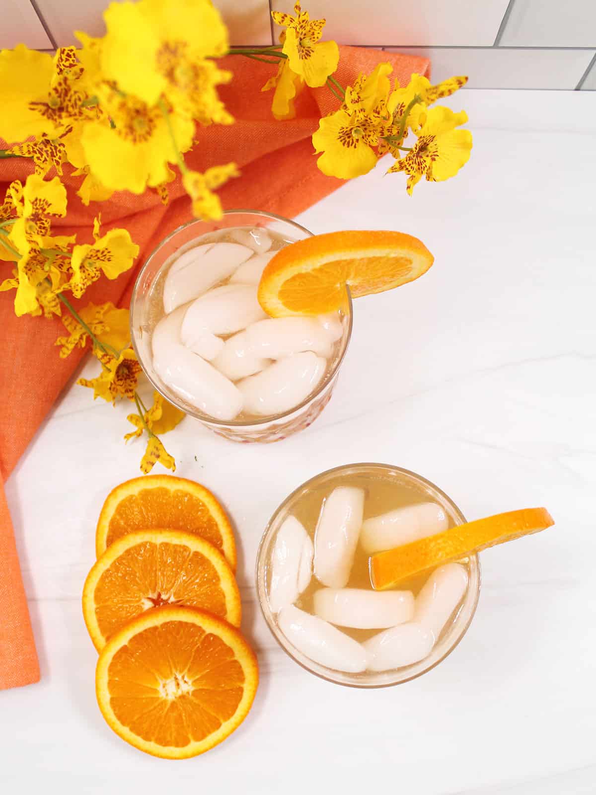 Overhead of two amaretto sour cocktails with sparkling water.