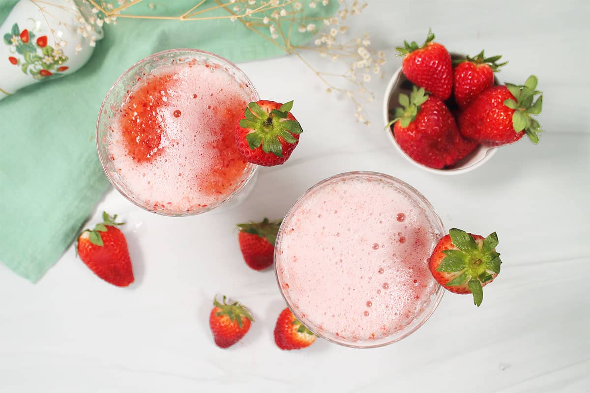 Overhead of strawberry cocktails.