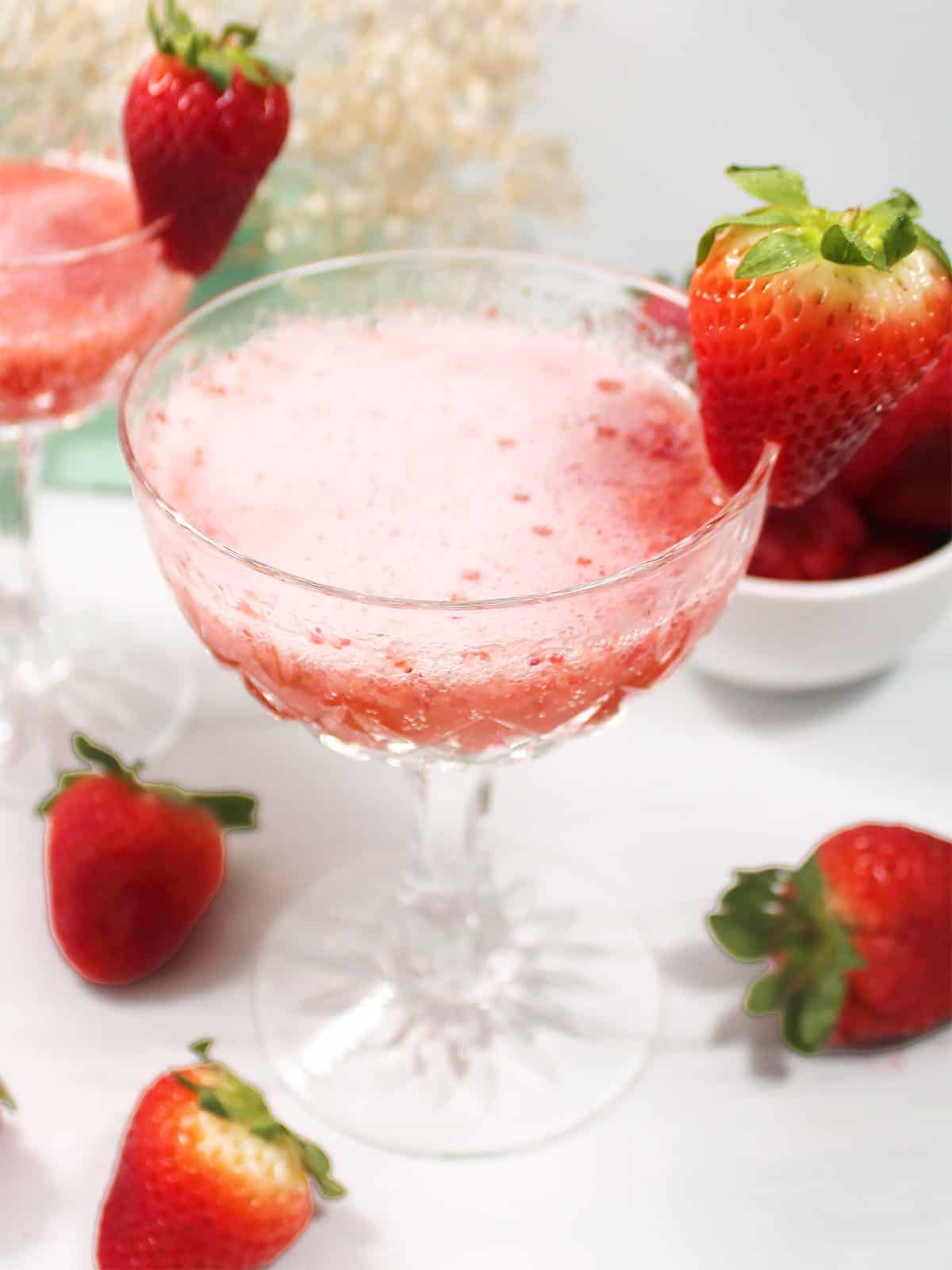 Closeup of strawberry Bellini with prosecco.
