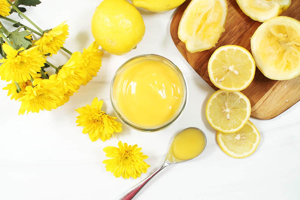 Overhead of simple lemon curd in jar.