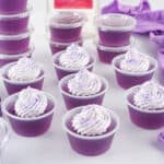Finished purple jello shots with garnish.