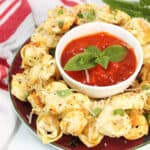 Crispy air fryer tortellini on platter with marinara.