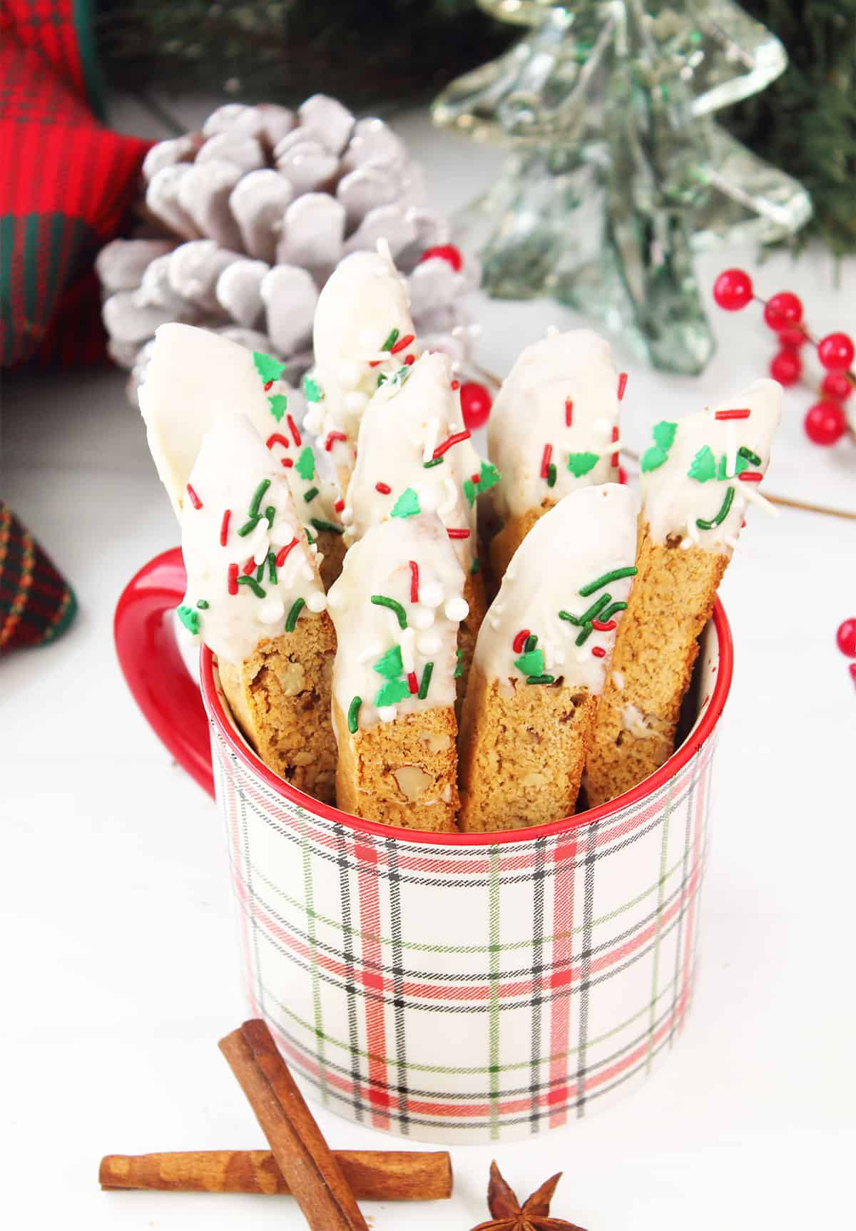 Christmas biscotti in plaid mug.