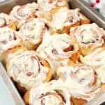 Pan of frosted gingerbread cinnamon rolls.