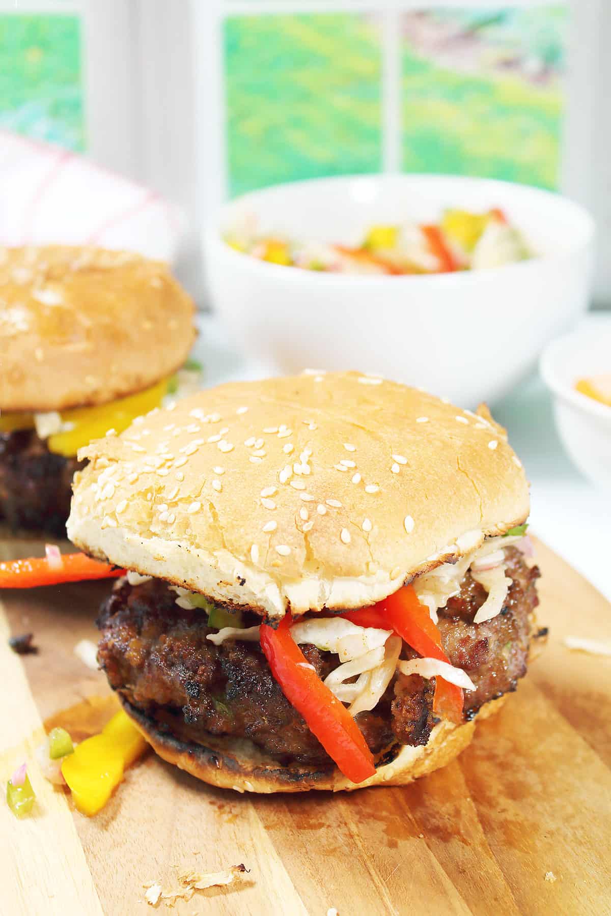 Burger on a toasted bun with slaw and ready to eat.
