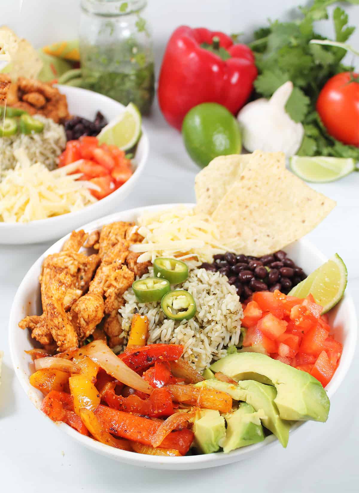 Prepared Chicken Fajita Bowl with Mexican Salad Dressing in jar.