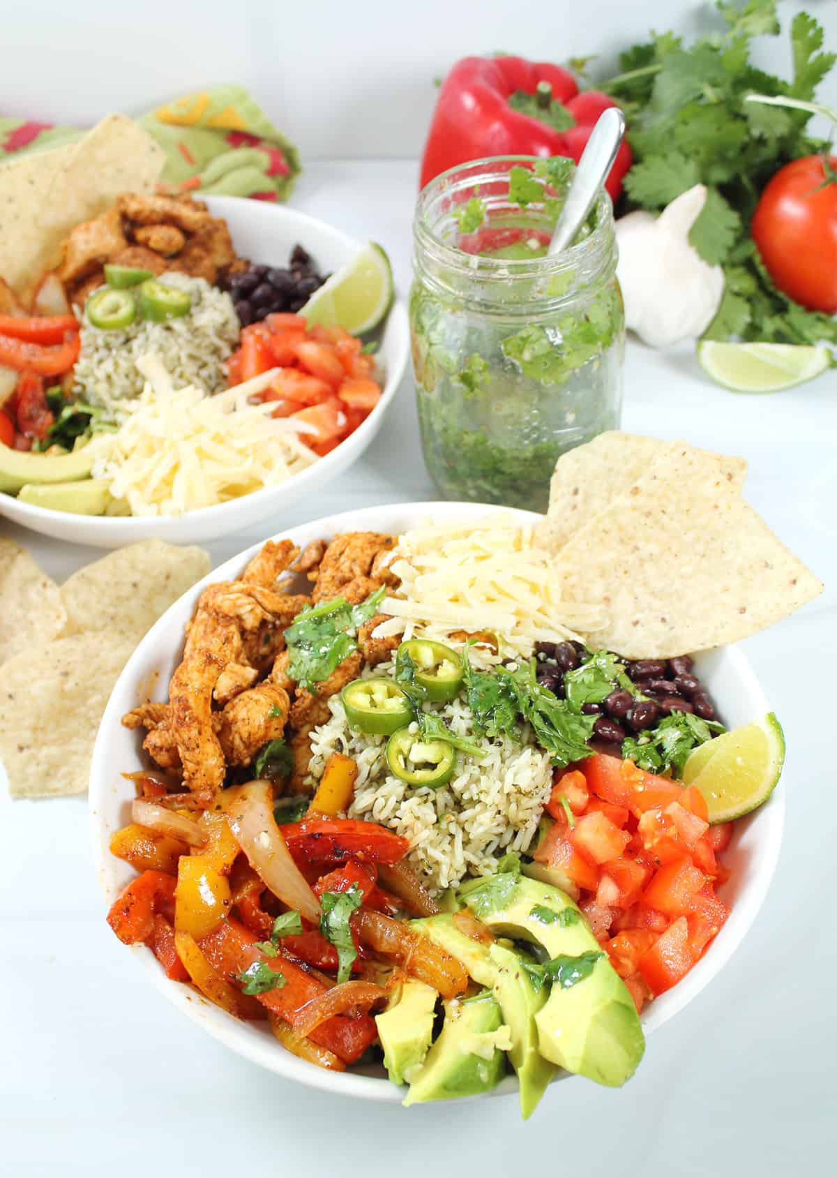 Chicken Fajita Rice Bowl with Mexican Salad dressing and tortilla chips.