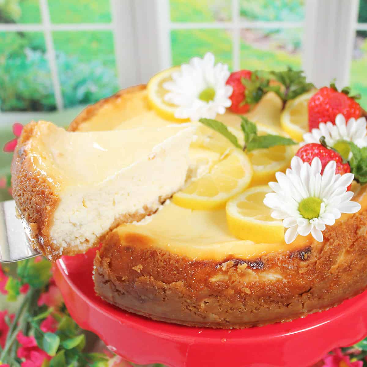 Lifting slice of lemon cheesecake from decorated cake.