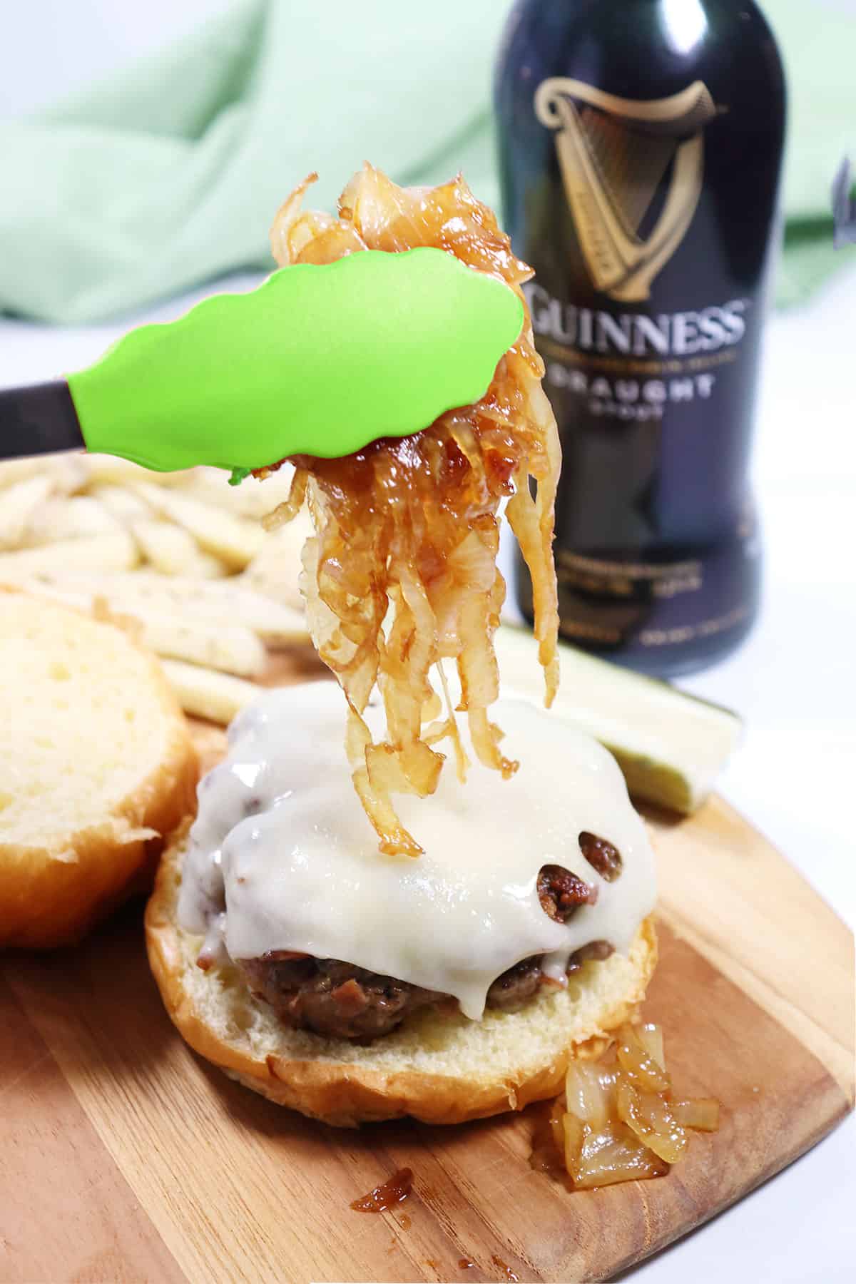 Topping burger with caramelized onions.