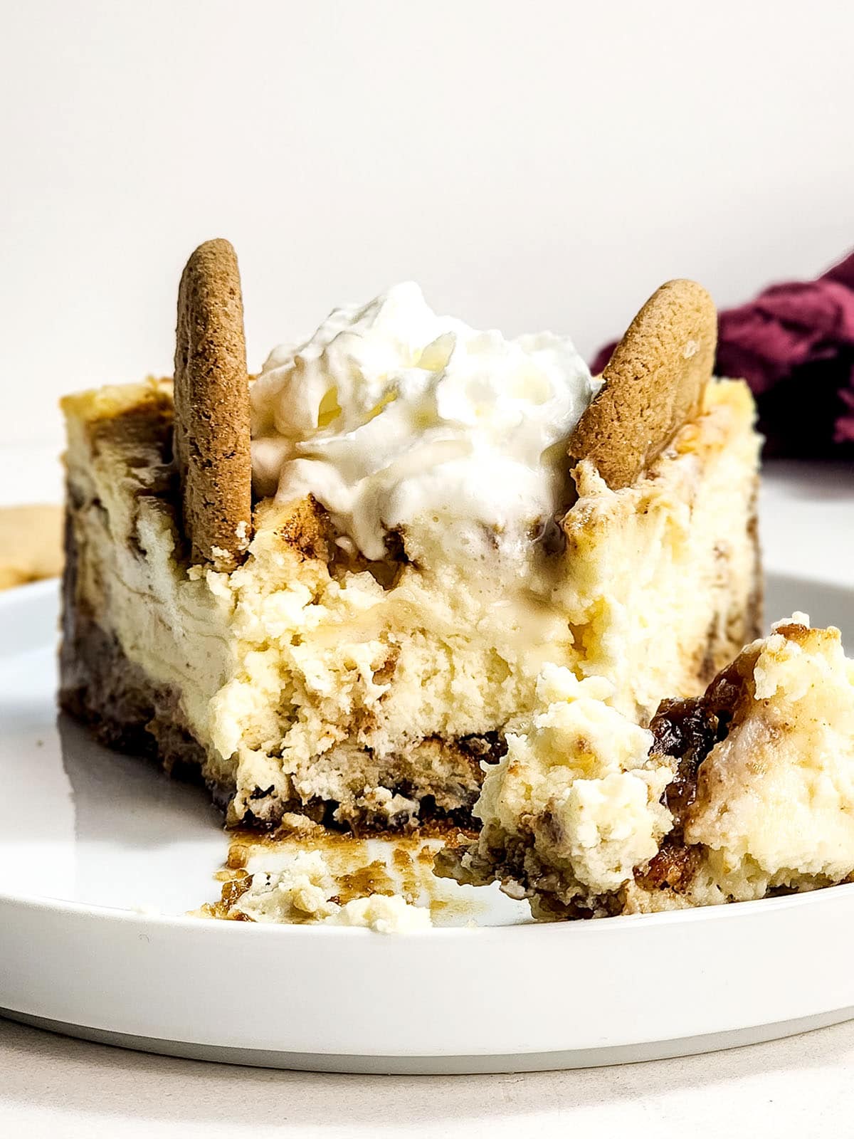 Slice of gingerbread cheesecake with bite out.