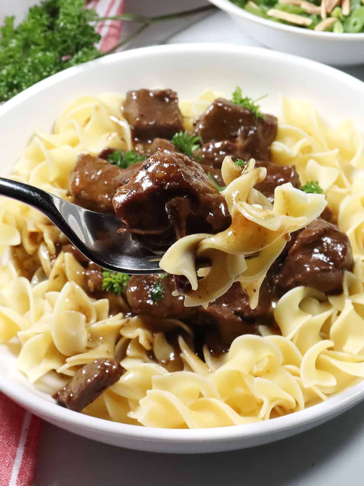 Forkful of instant pot beef with gravy.