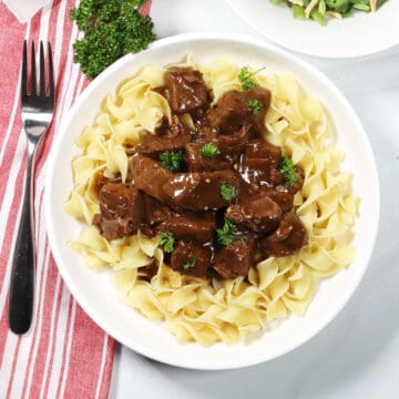 Instant Pot Beef Tips and Gravy over noodles.