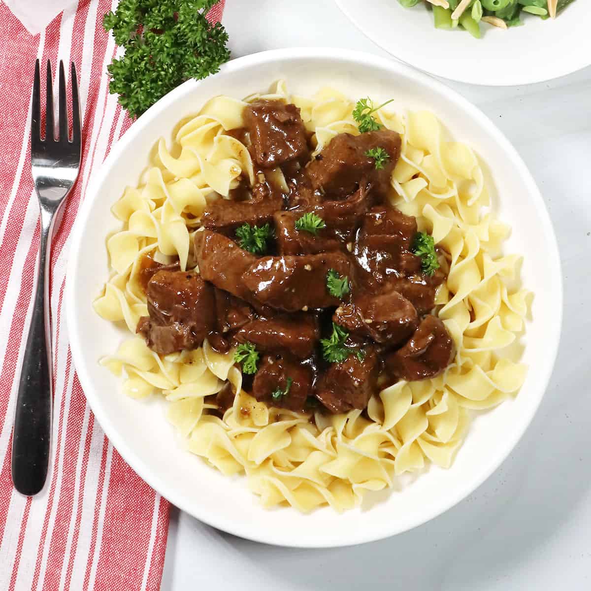 Instant Pot Beef Tips and Gravy over noodles.