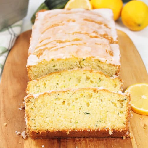 Sliced Lemon Zucchini Bread with lemon glaze.