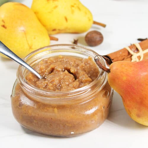 Jarred Pear Butter with spoon.