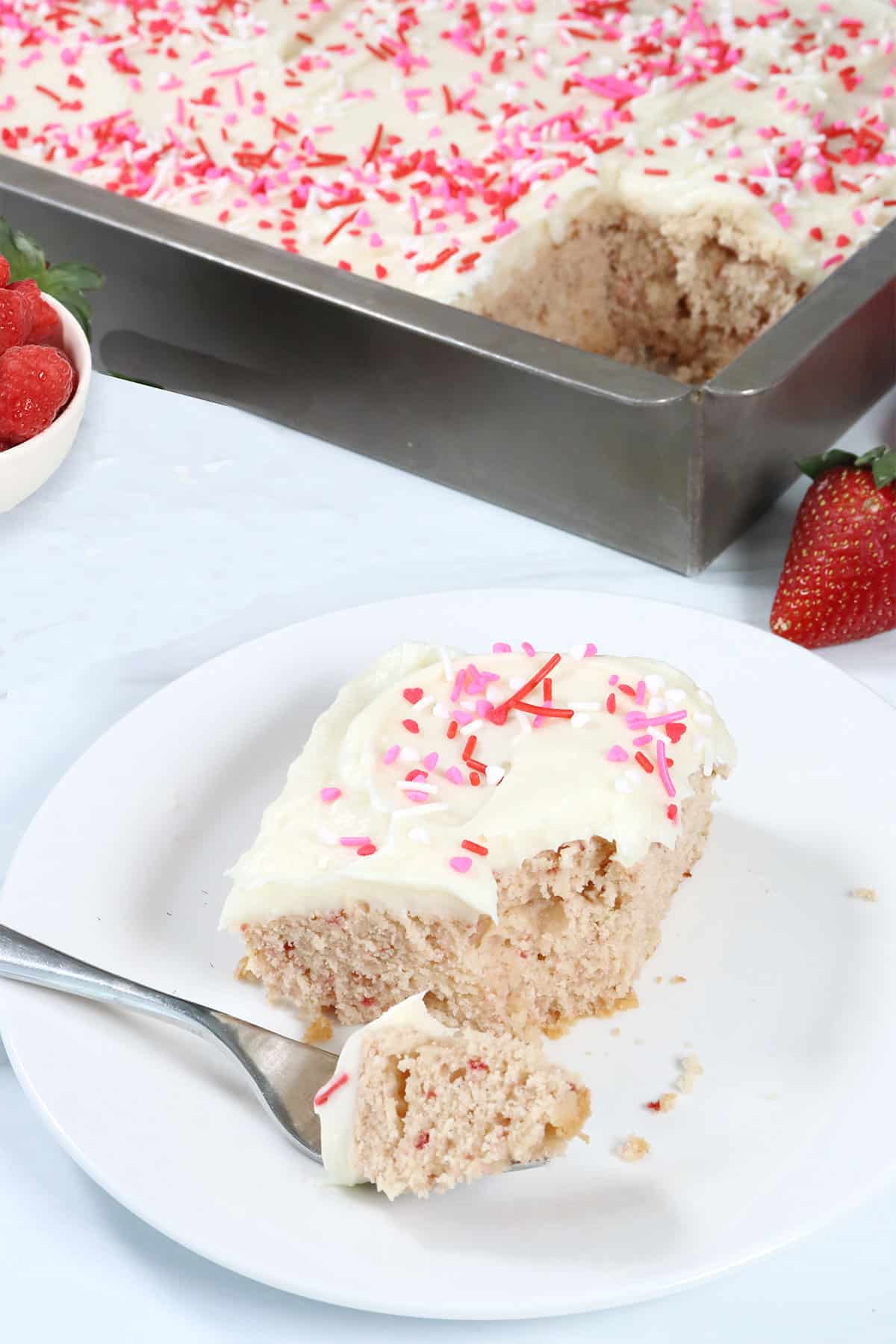 Pink Velvet Sheet Cake slice with bite on fork.