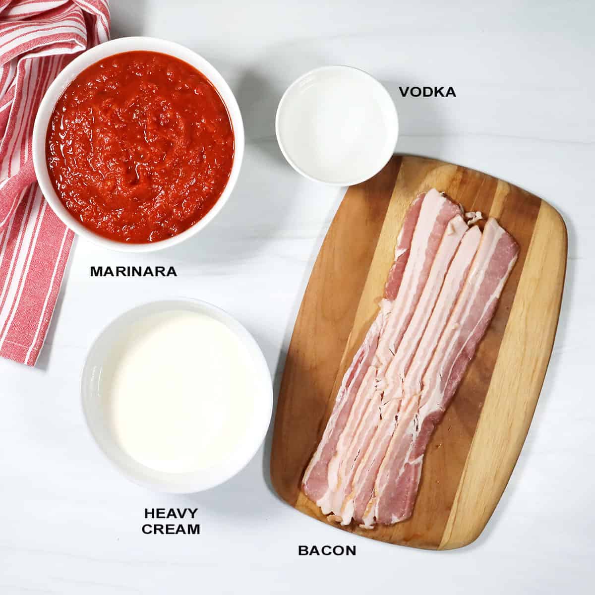 Ingredients for easy vodka sauce from marinara.