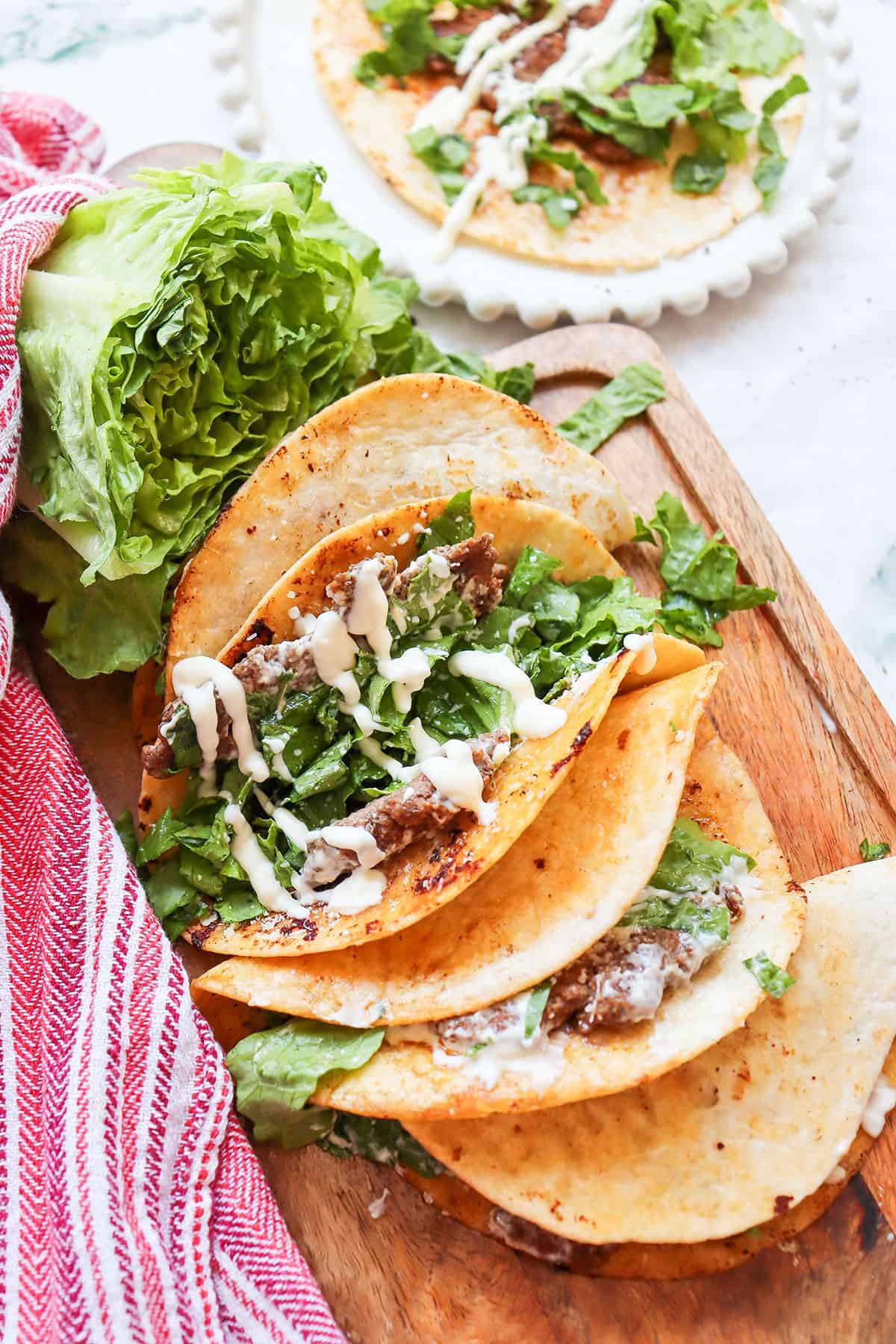Upright smash tacos showing filling.