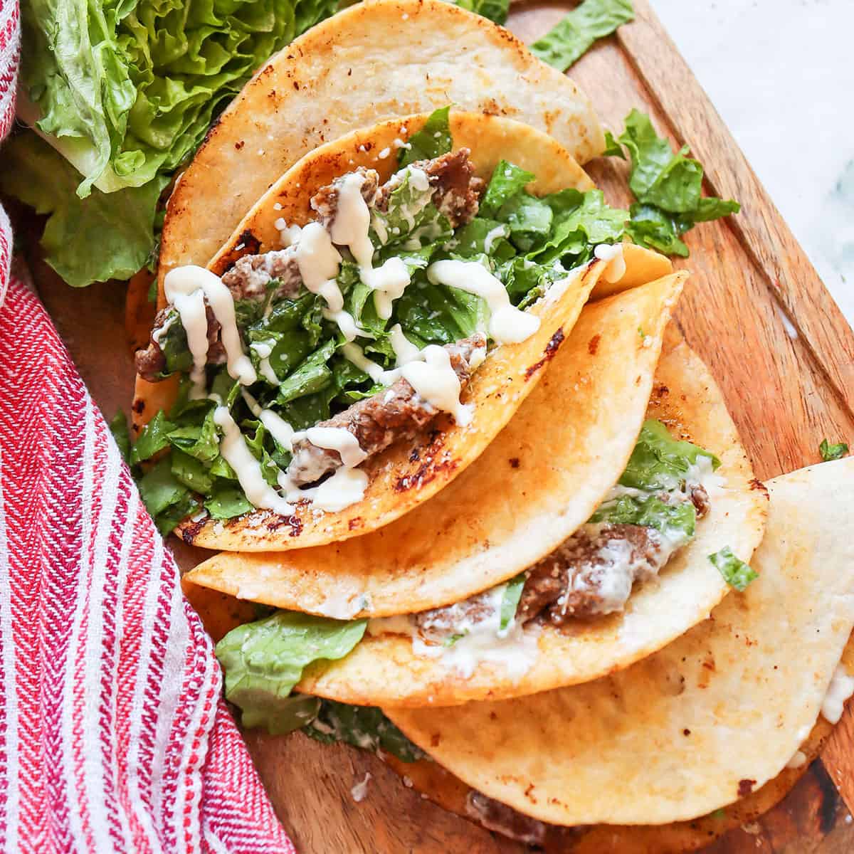 Caesar Salad Smash Tacos showing filling.