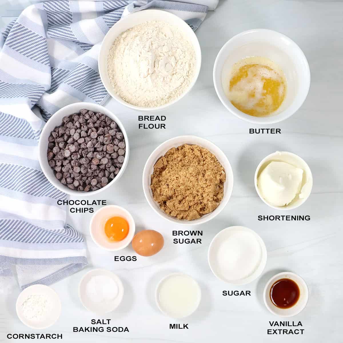 Ingredients to make soft chocolate chip cookies with bred flour.