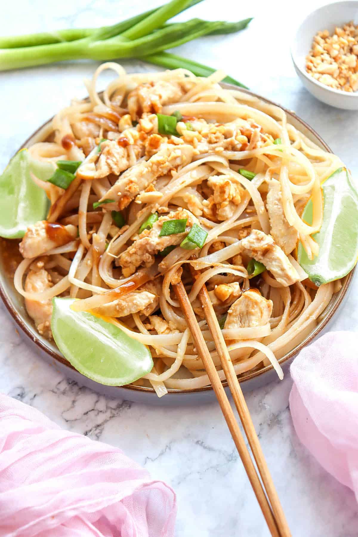 Easy Chicken Pad Thai plated with chopsticks.