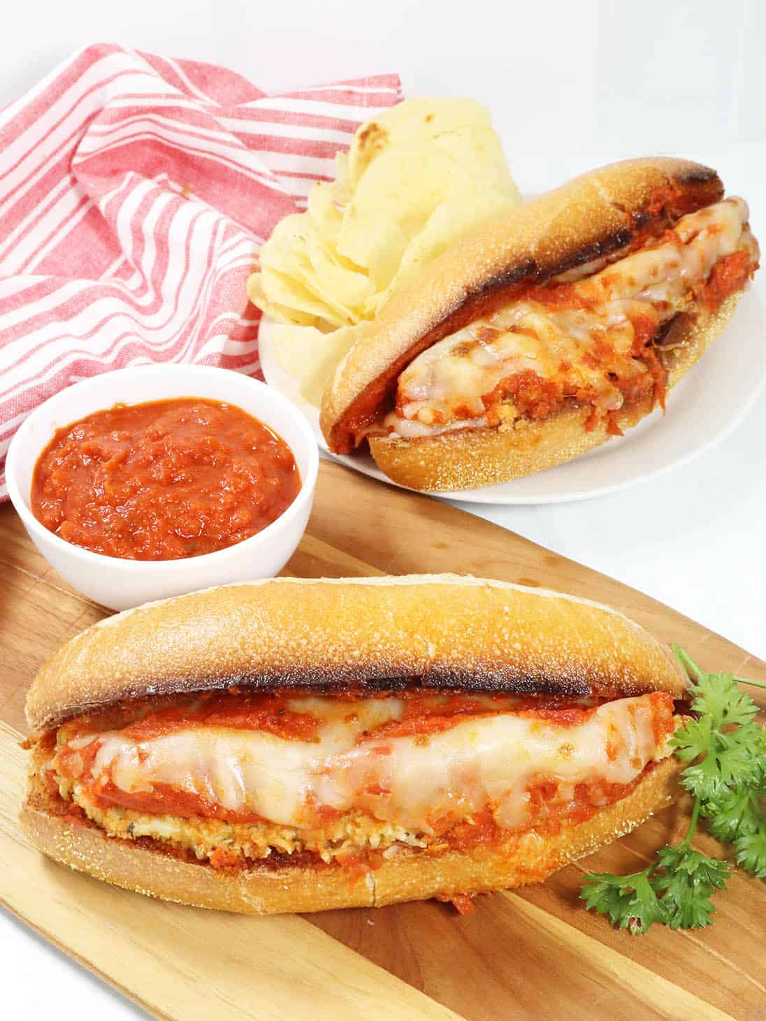Chicken Parmesan Subs on cutting board.
